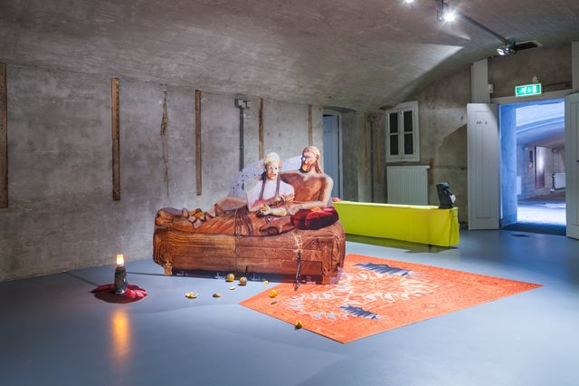 Catherine Biocca, Amsterdam Art Weekend 2021, Audio and video installation with performative elements, dibond prints, ink jet on carpet, oranges, textile, benches, tables, tissue dispenser, knives, screen, mirror, print on polyester., Mi-ko, installation view at Museum Kunstfort Vijfhuizen, 2018, 2016