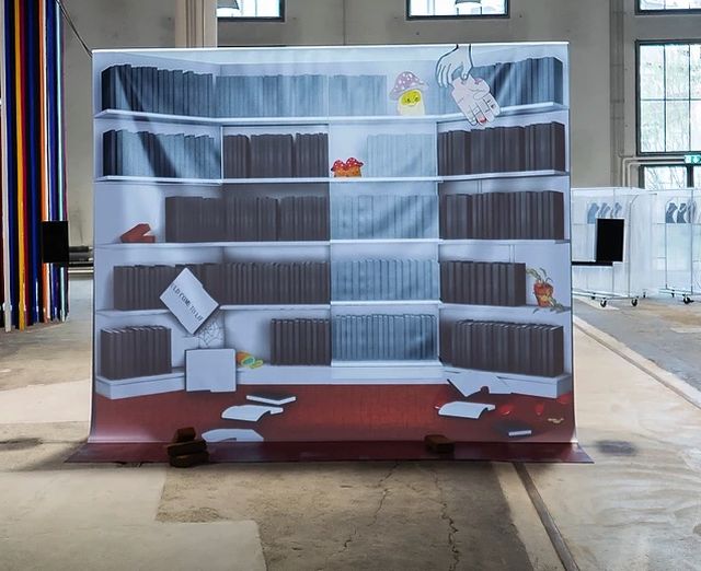 Catherine Biocca, Amsterdam Art Weekend 2021, Sound and video installation, pic print, projection, speaker, metal rack, fake bricks, hand carved marble book, Exhibition view Camouflage, Kunstmuseum St Gallen, 2019,