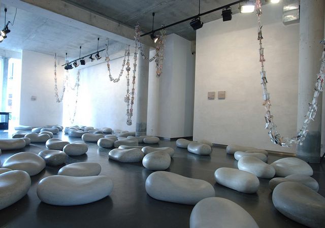 Irene Fortuyn, Buntings made out of newspaper and polished concrete cast stones, Mending Days (Installation View), 2007