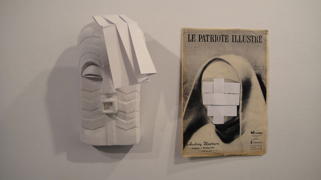 Jimmy Robert, Spray painted wooden mask, newspaper, Relaxed I, 2011